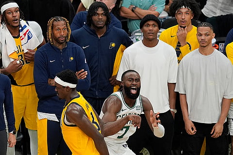 Jaylen Brown (7) reacts after he makes a 3-point shot